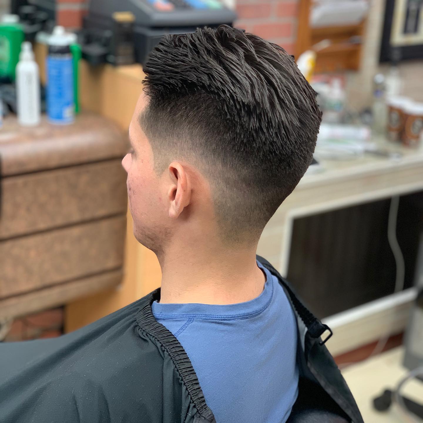 Mid-taper fade with a textured top